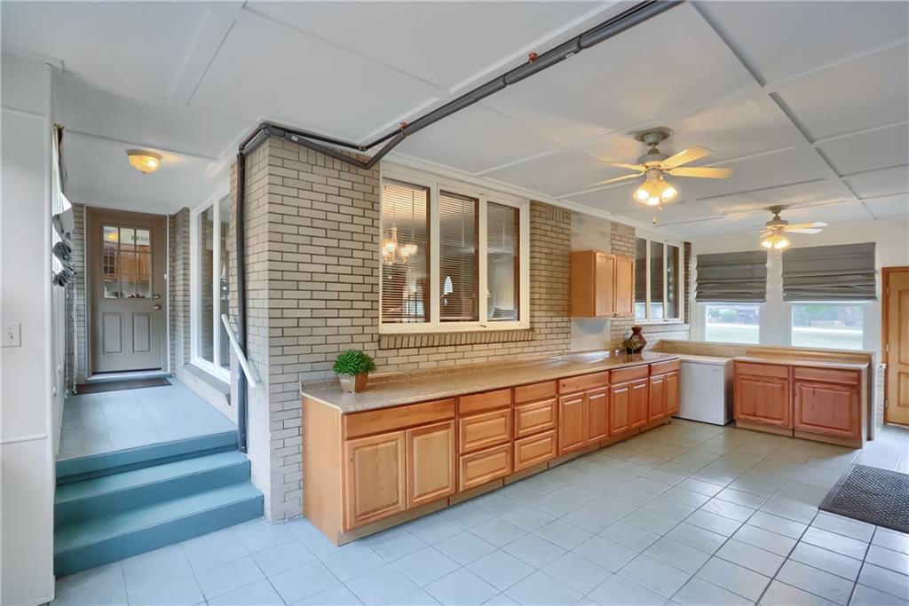 436 Blackhawk Road Beaver Falls, PA 15010 - Photo 29 of 48 Additiona room. Breezeway the is great for entertaining between the kitchen and garage. Walk right out to the deck.