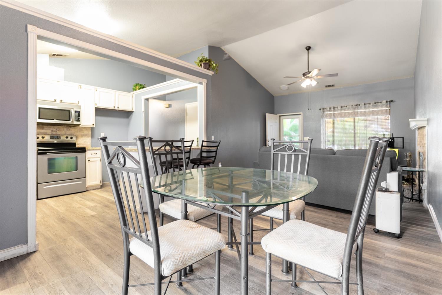 600 Sears Drive Patterson, CA 95363 - Photo 14 of 44 a dining room with furniture and wooden floor