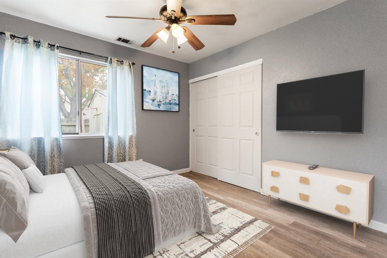 600 Sears Drive Patterson, CA 95363 - Photo 28 of 44 a bedroom with a bed and a flat screen tv