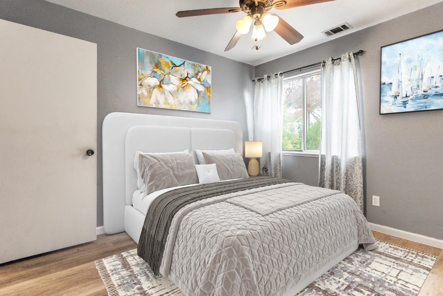 600 Sears Drive Patterson, CA 95363 - Photo 30 of 44 a bedroom with a large bed and a window