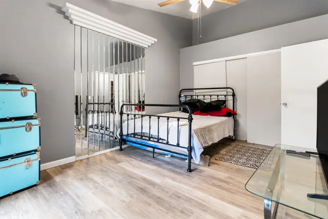 a bedroom with a bed and a window