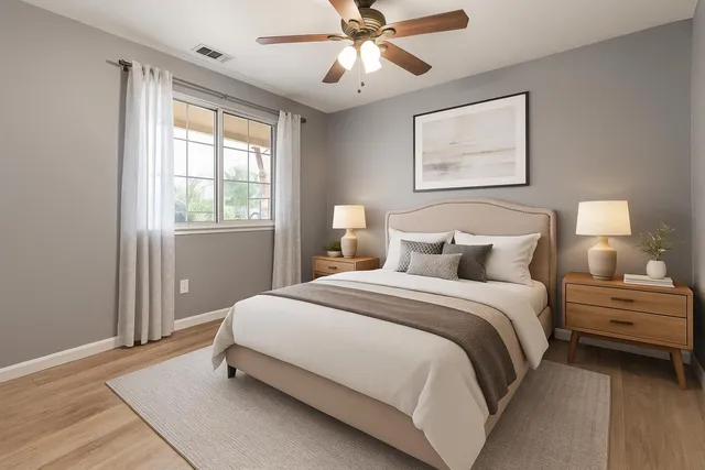 a bedroom with a bed and a window