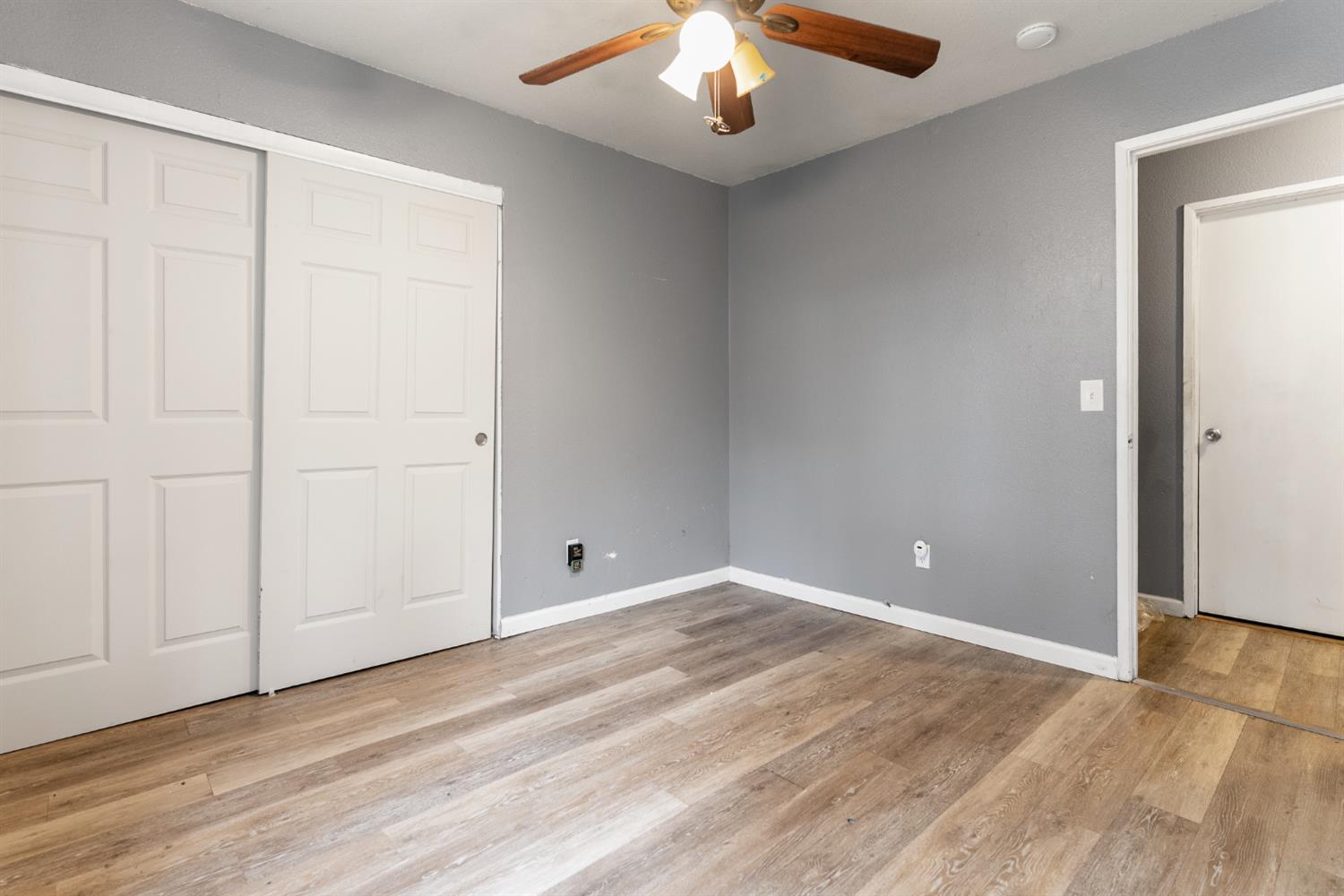600 Sears Drive Patterson, CA 95363 - Photo 37 of 44 an empty room with wooden floor and windows