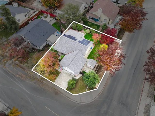 an aerial view of house with yard