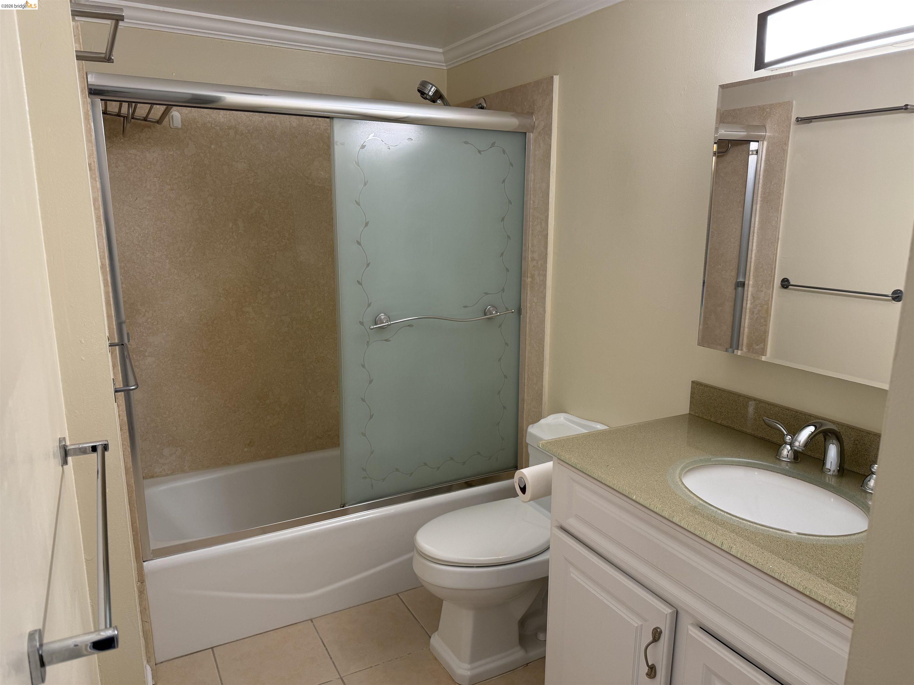 801 Franklin Street, Unit 1239 Oakland, CA 94607 - Photo 13 of 15 a bathroom with a granite countertop sink toilet and shower