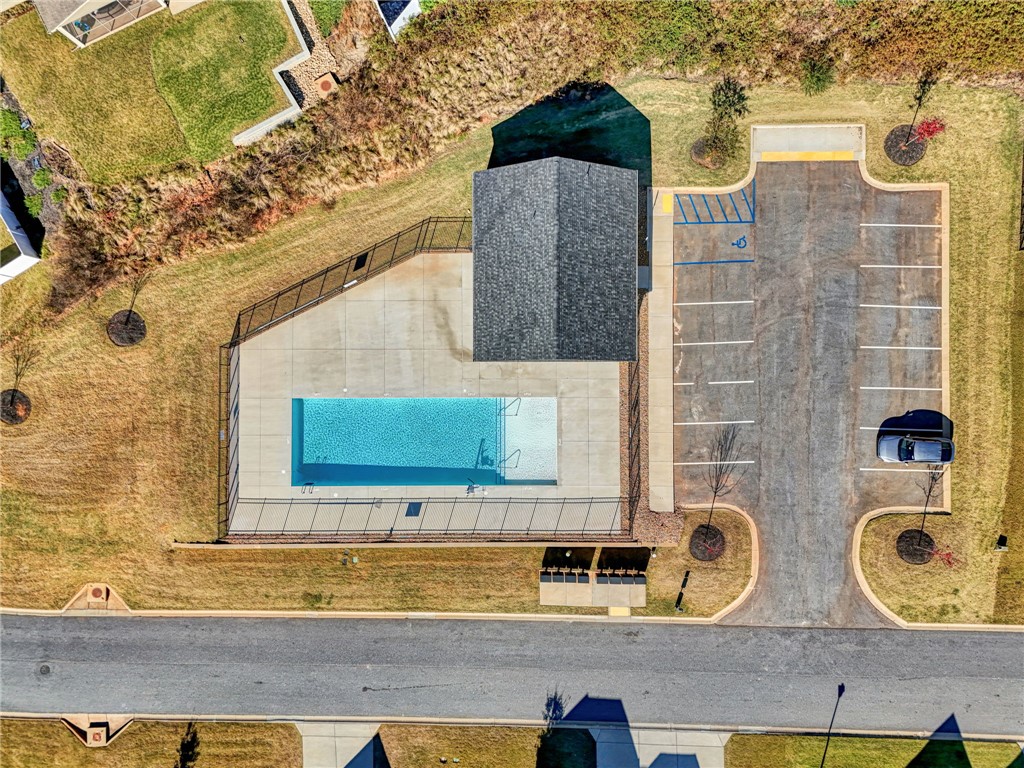 142 Juniper Hill Drive Easley, SC 29642 - Photo 44 of 47 An aerial view captures the community pool and parking, ideal for leisurely afternoons.