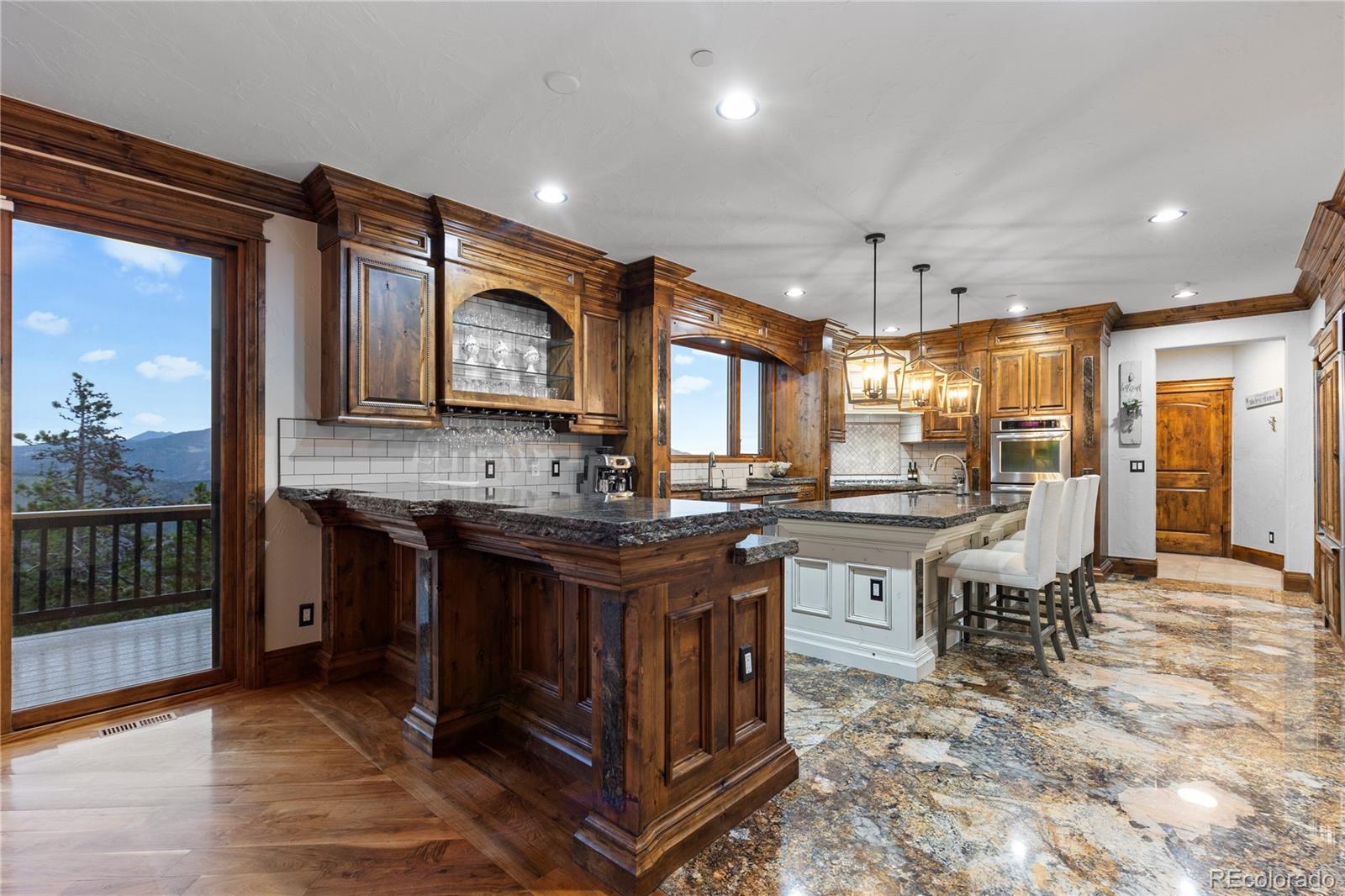 100 Halter Way Evergreen, CO 80439 - Photo 13 of 40 a kitchen with lots of counter top space and painting