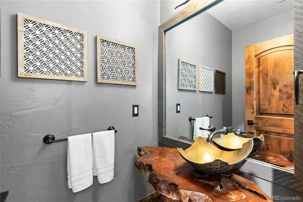 a bedroom with a bed and glass window