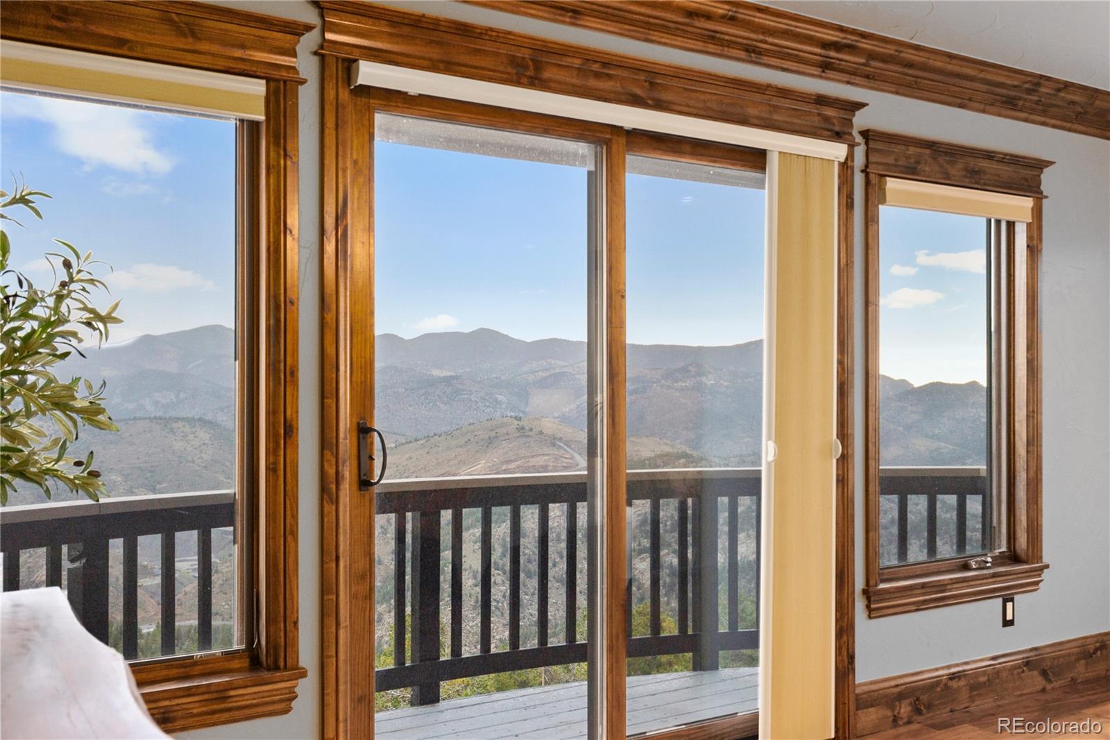 100 Halter Way Evergreen, CO 80439 - Photo 28 of 40 a view of a balcony with a door