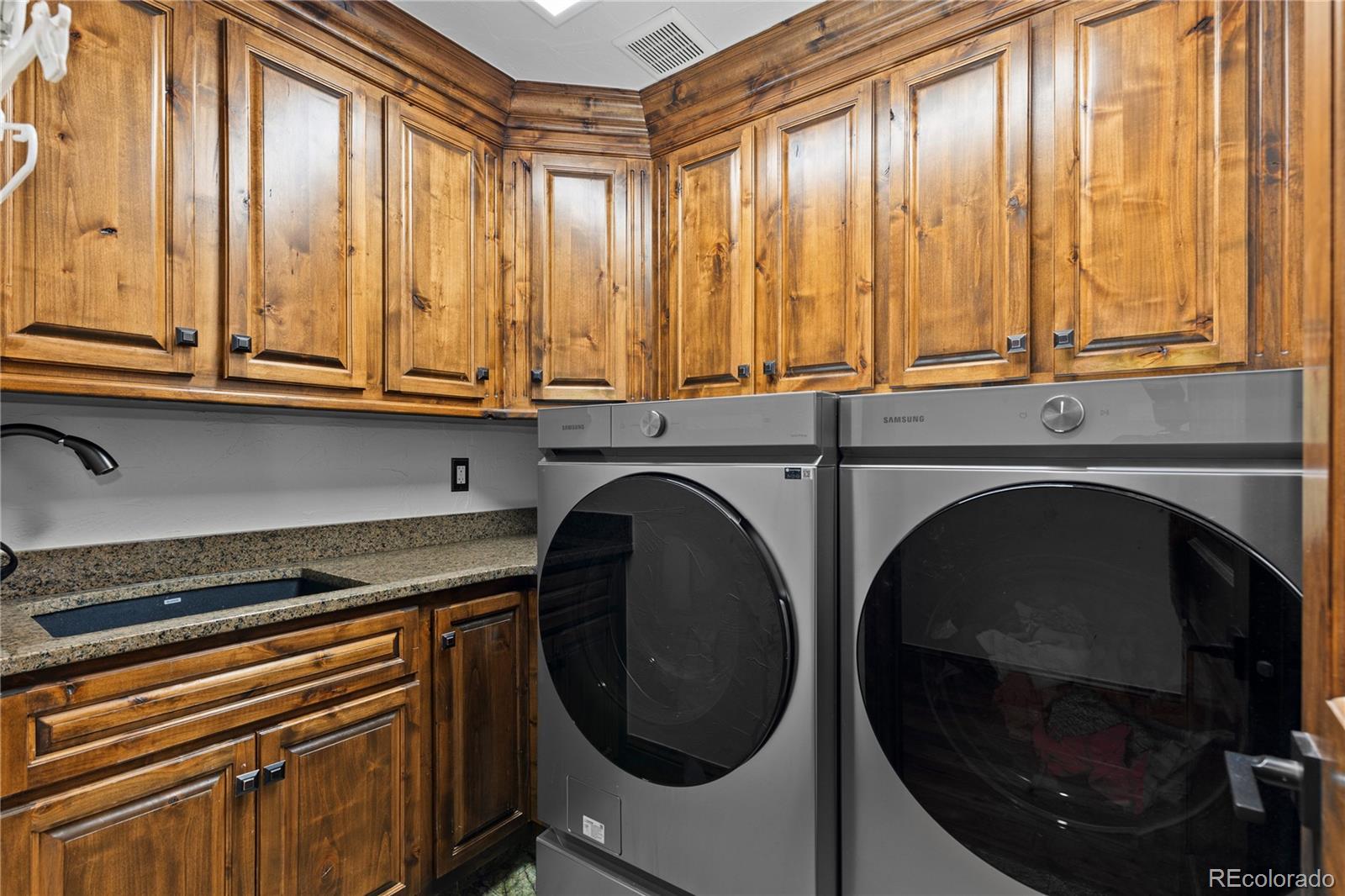 100 Halter Way Evergreen, CO 80439 - Photo 34 of 40 a kitchen with a large window and red door