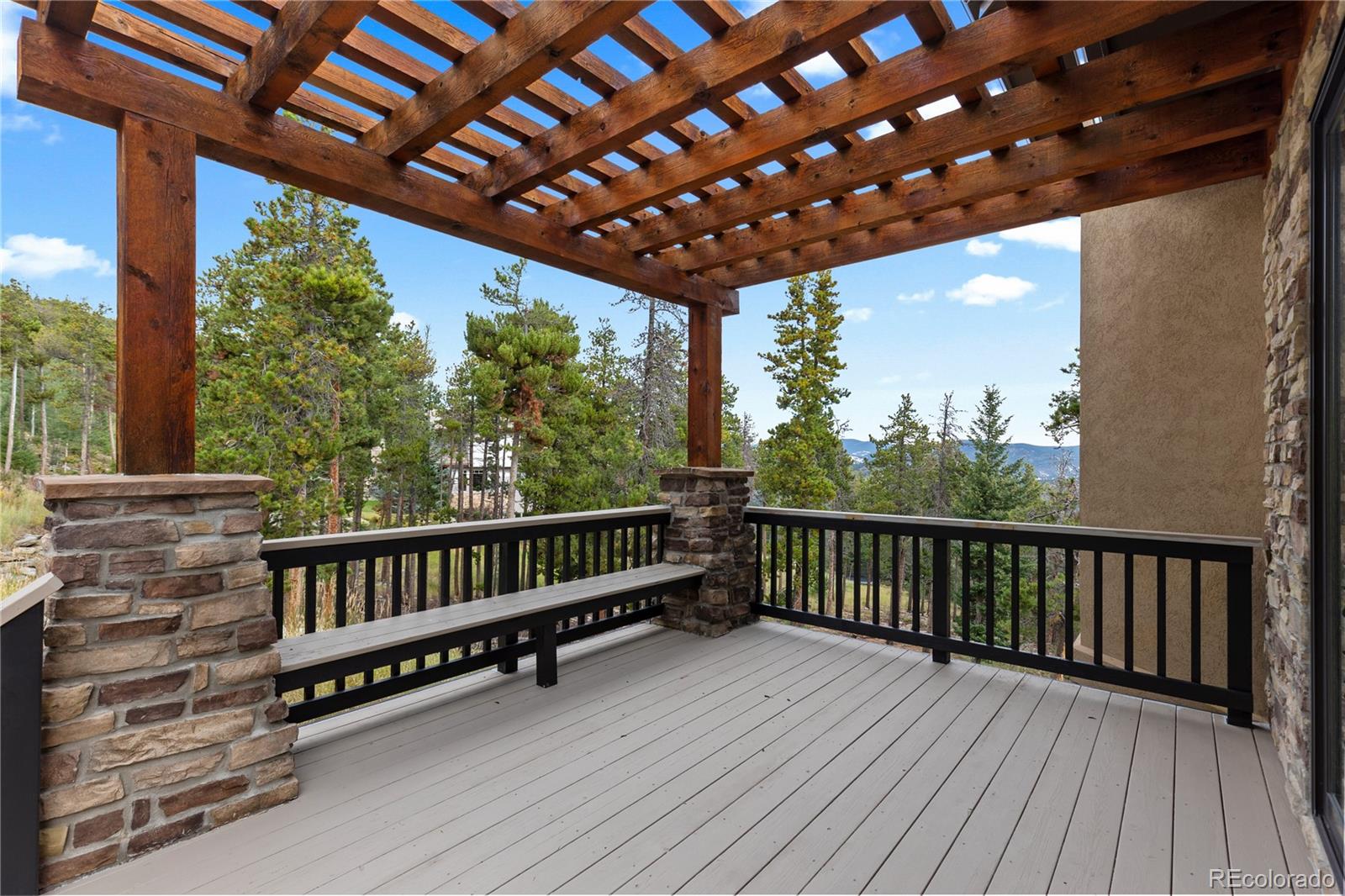100 Halter Way Evergreen, CO 80439 - Photo 7 of 40 a view of a roof deck with wooden floor