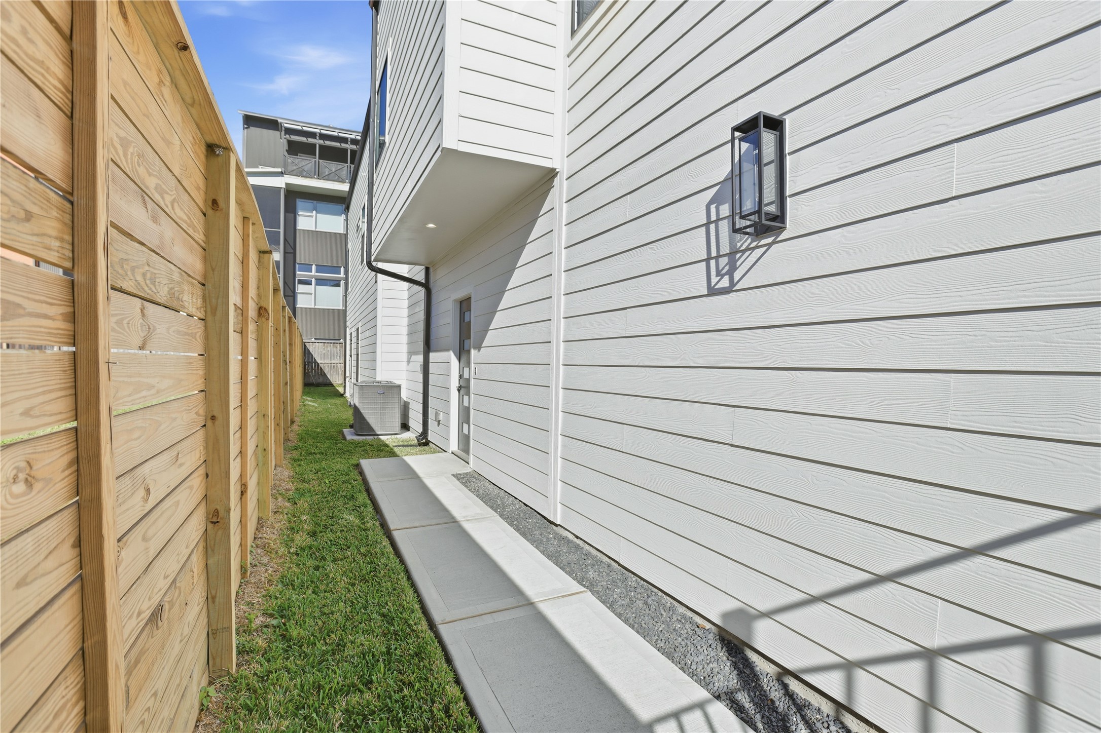 712 Delano Street, Unit A Houston, TX 77003 - Photo 29 of 35 a view of a pathway with a white door