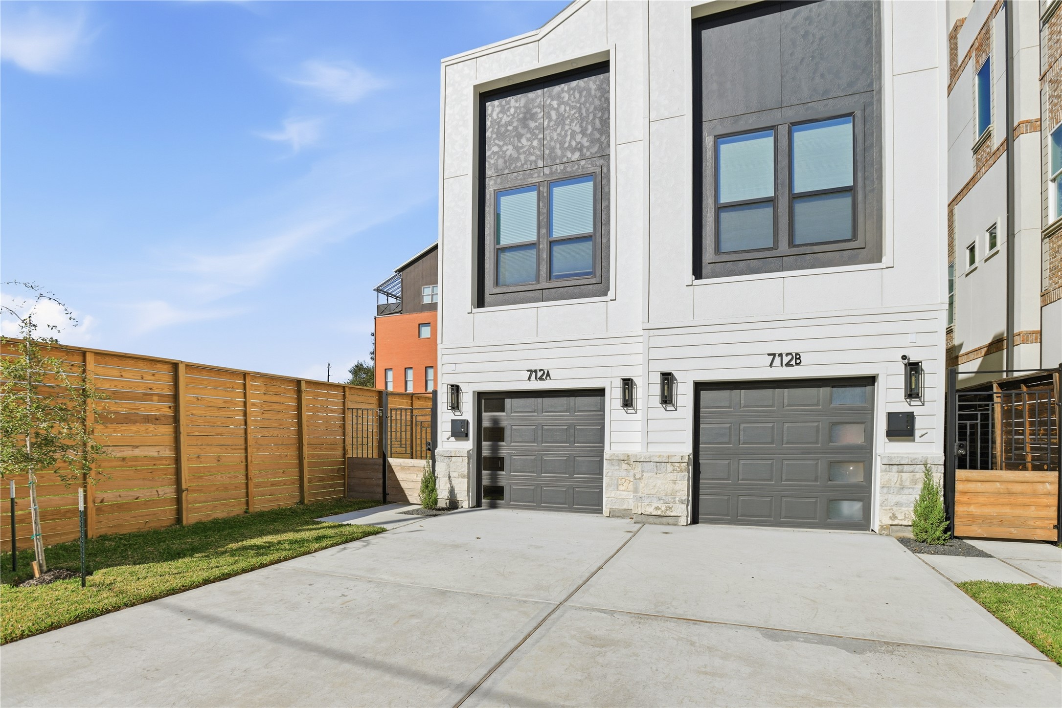 712 Delano Street, Unit A Houston, TX 77003 - Photo 32 of 35 a front view of a building with garage