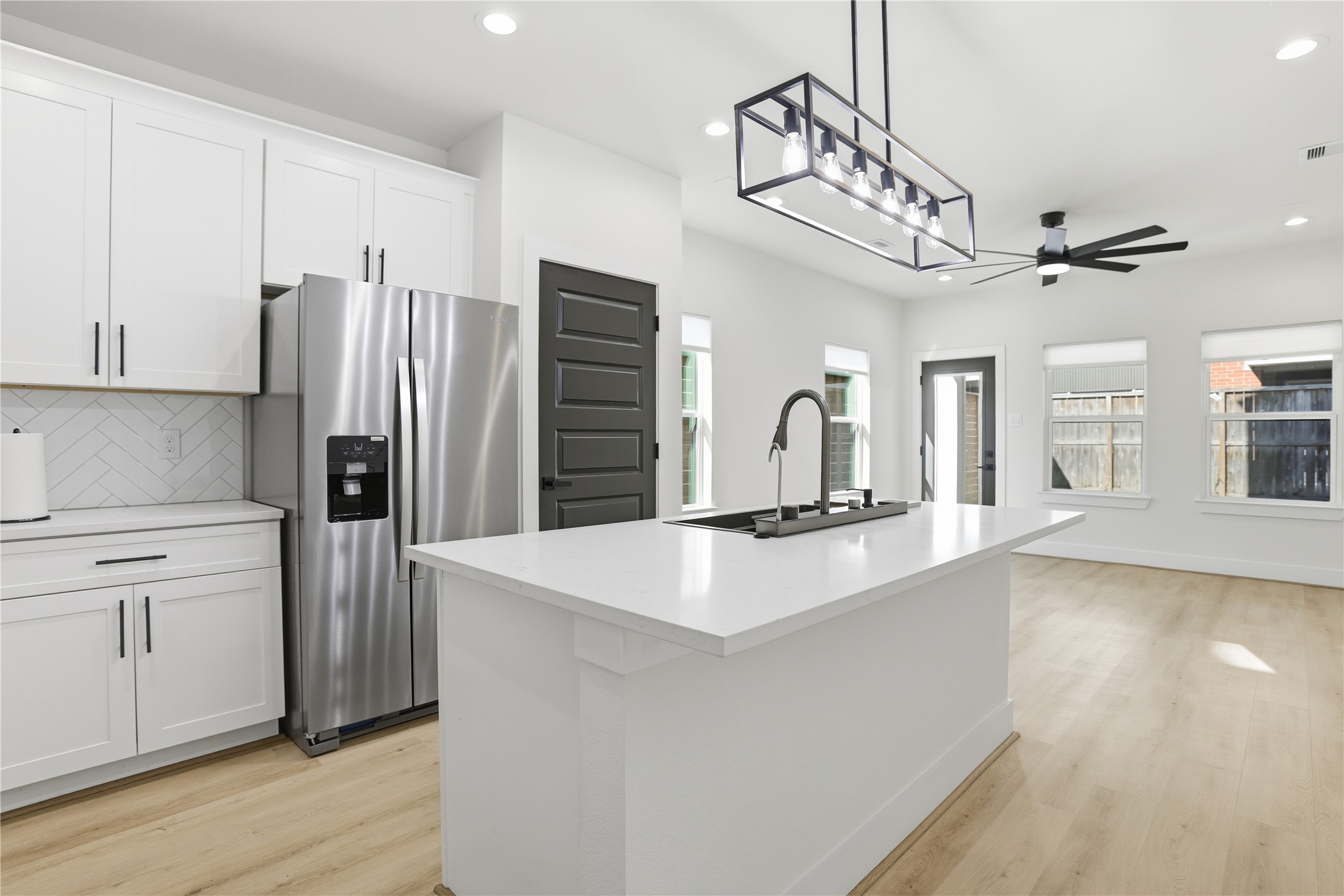 712 Delano Street, Unit A Houston, TX 77003 - Photo 4 of 35 a kitchen with stainless steel appliances a refrigerator and a stove