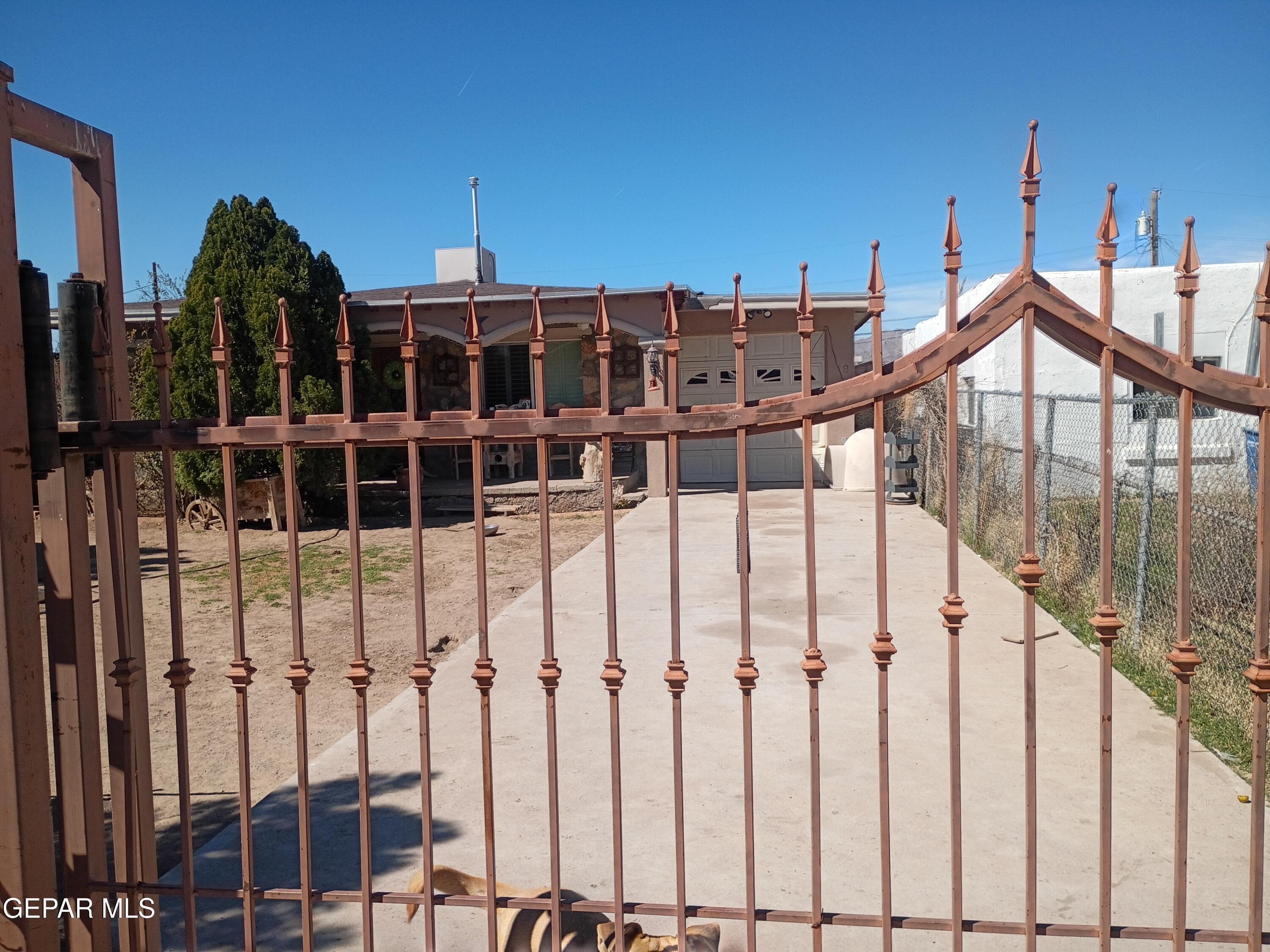 225 Polo Inn Road El Paso, TX 79915 - Photo 10 of 12 a view of a house with wooden fence