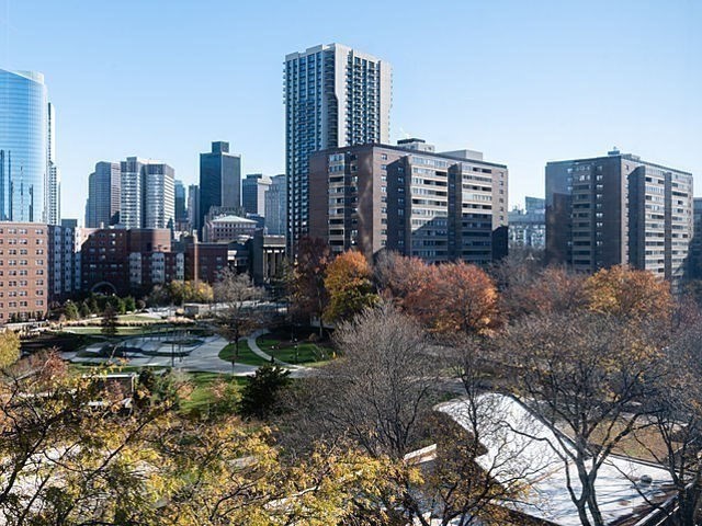 6 Whittier Place, Unit 9E Boston, MA 02114 - Photo 13 of 24 a view of a city with tall buildings