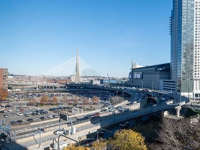 a view of a lake with a city skyline in the background