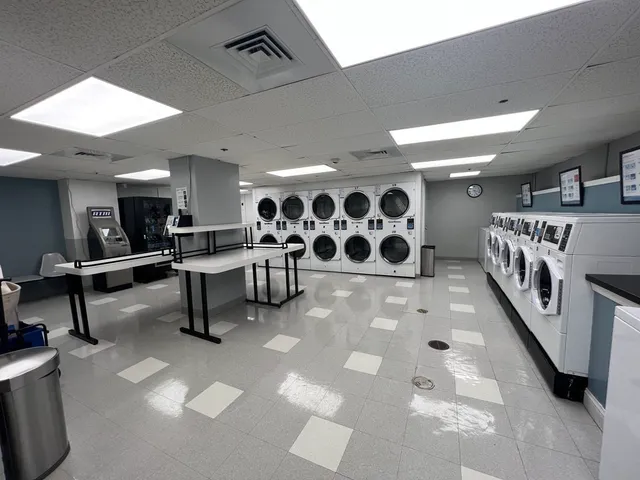 a living room with lots of furniture and white walls