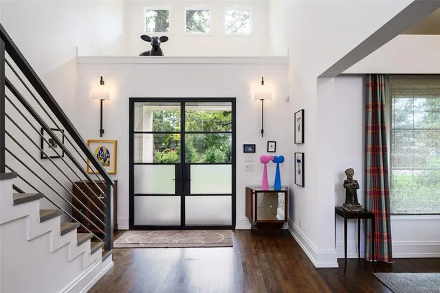 a view of entryway with wooden floor and stairs