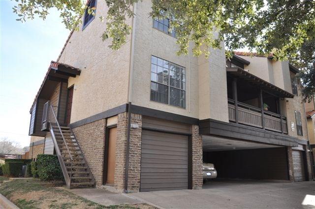 5630 Spring Valley Road, Unit 17A Dallas, TX 75254 - Photo 5 of 14 a front view of a house with a garage