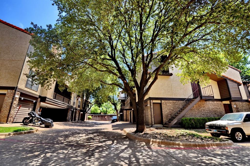 5630 Spring Valley Road, Unit 17A Dallas, TX 75254 - Photo 9 of 14 a car parked in front of a house