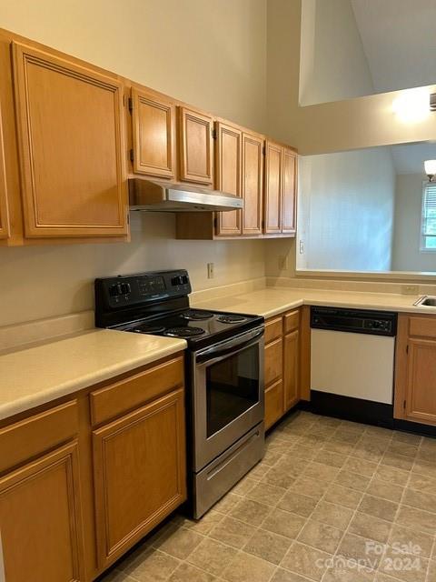 19940 Oak Leaf Circle Cornelius, NC 28031 - Photo 15 of 21 a kitchen with stainless steel appliances granite countertop a stove a sink and a microwave