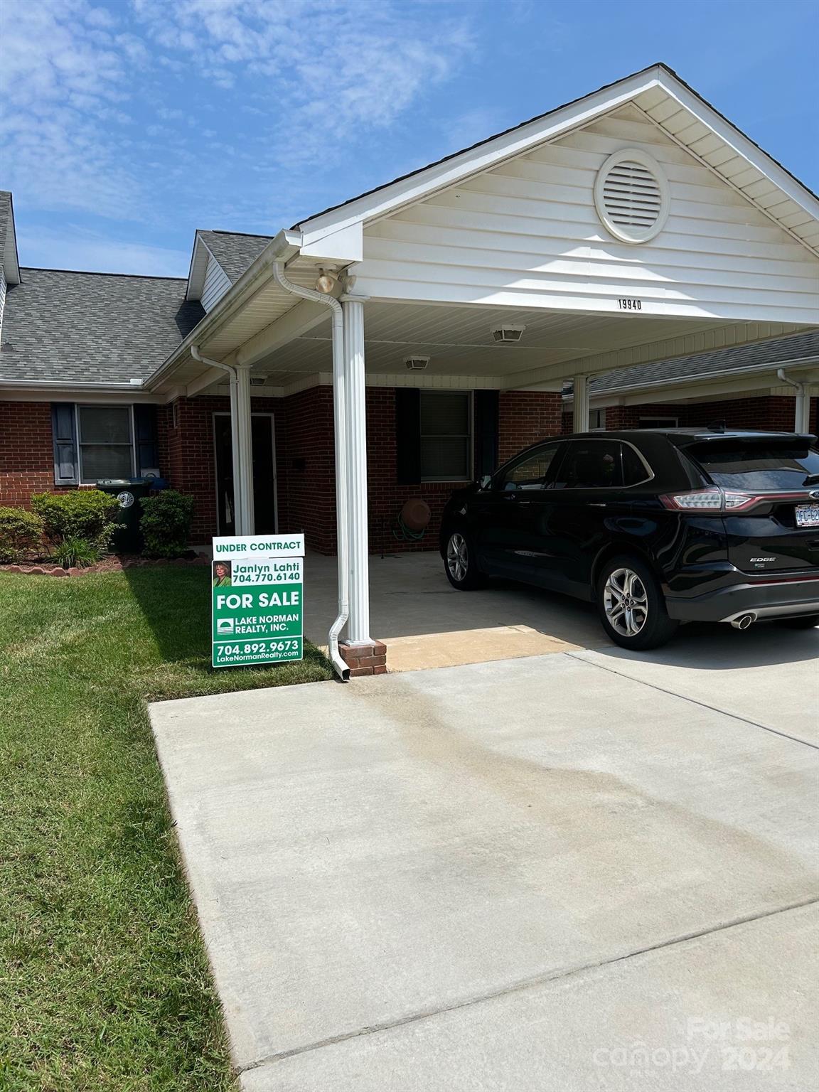 19940 Oak Leaf Circle Cornelius, NC 28031 - Photo 21 of 21 a car parked in front of a building