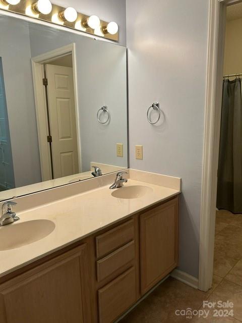 19940 Oak Leaf Circle Cornelius, NC 28031 - Photo 9 of 21 a bathroom with a double vanity sink and mirror