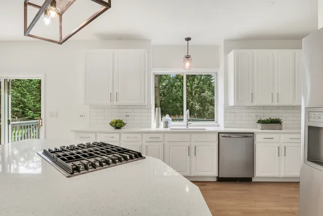 a kitchen with a sink and cabinets