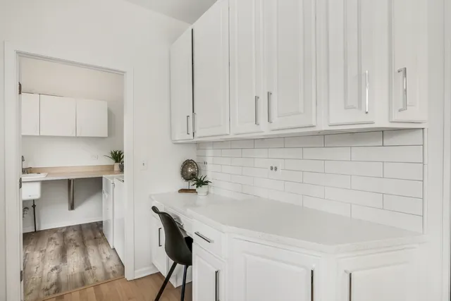 a utility room with sink dryer and washer