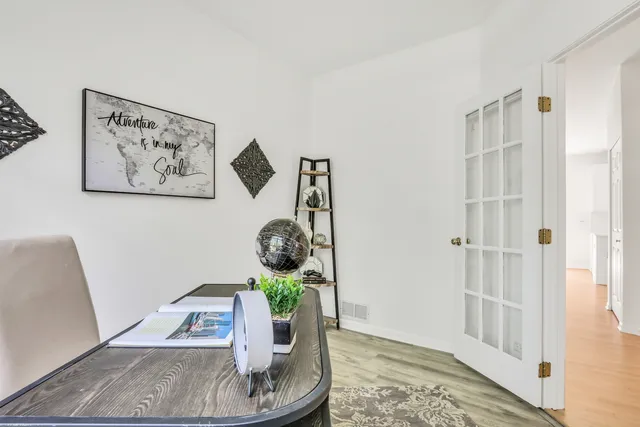 a bed room with a bed and a chair