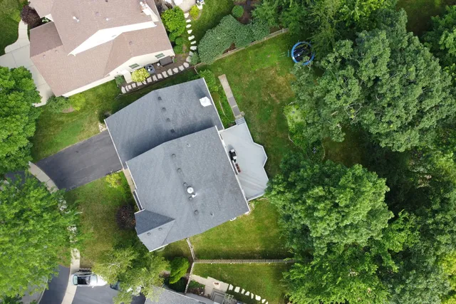 a living room with furniture and large windows