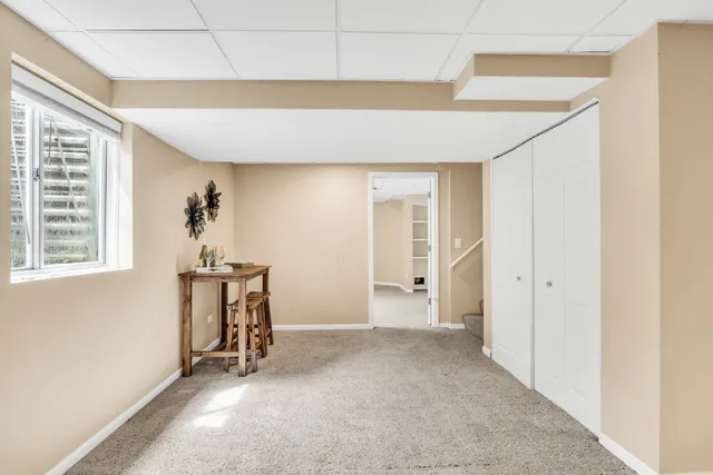 a view of a house with a yard and sitting area