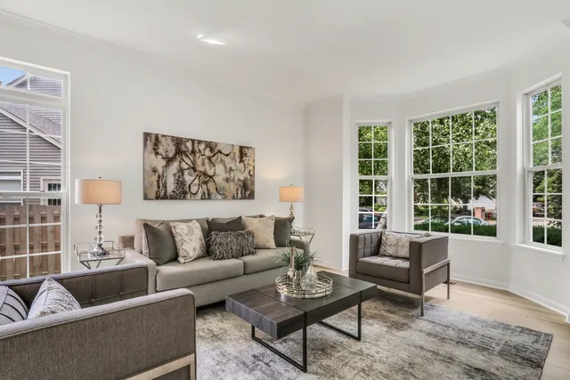 a dining room with furniture and window