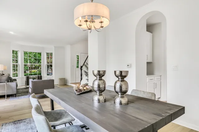 a kitchen with a refrigerator and a stove