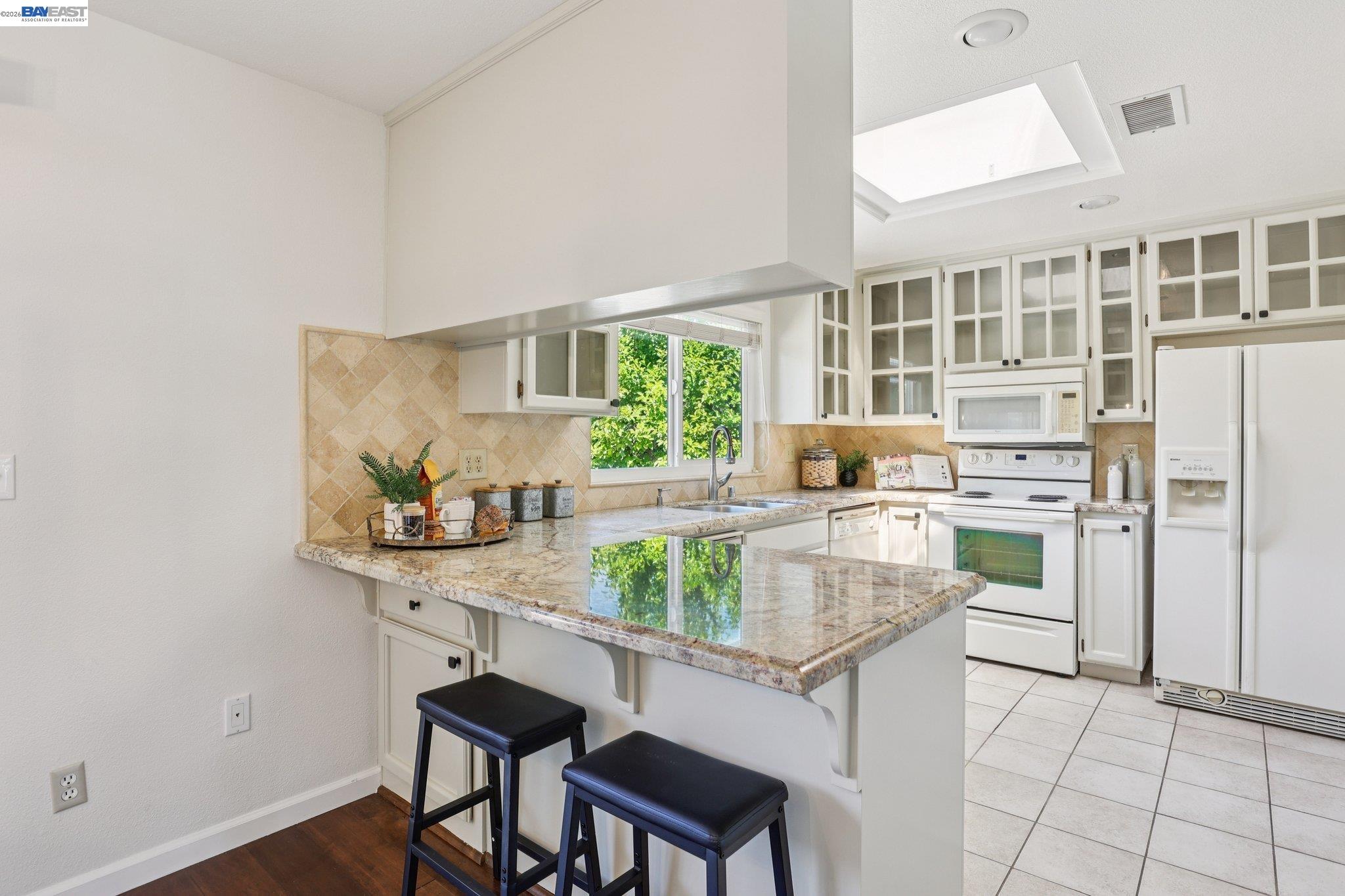 1113 Tokay Common Livermore, CA 94550 - Photo 11 of 30 a kitchen with a table and chairs in it