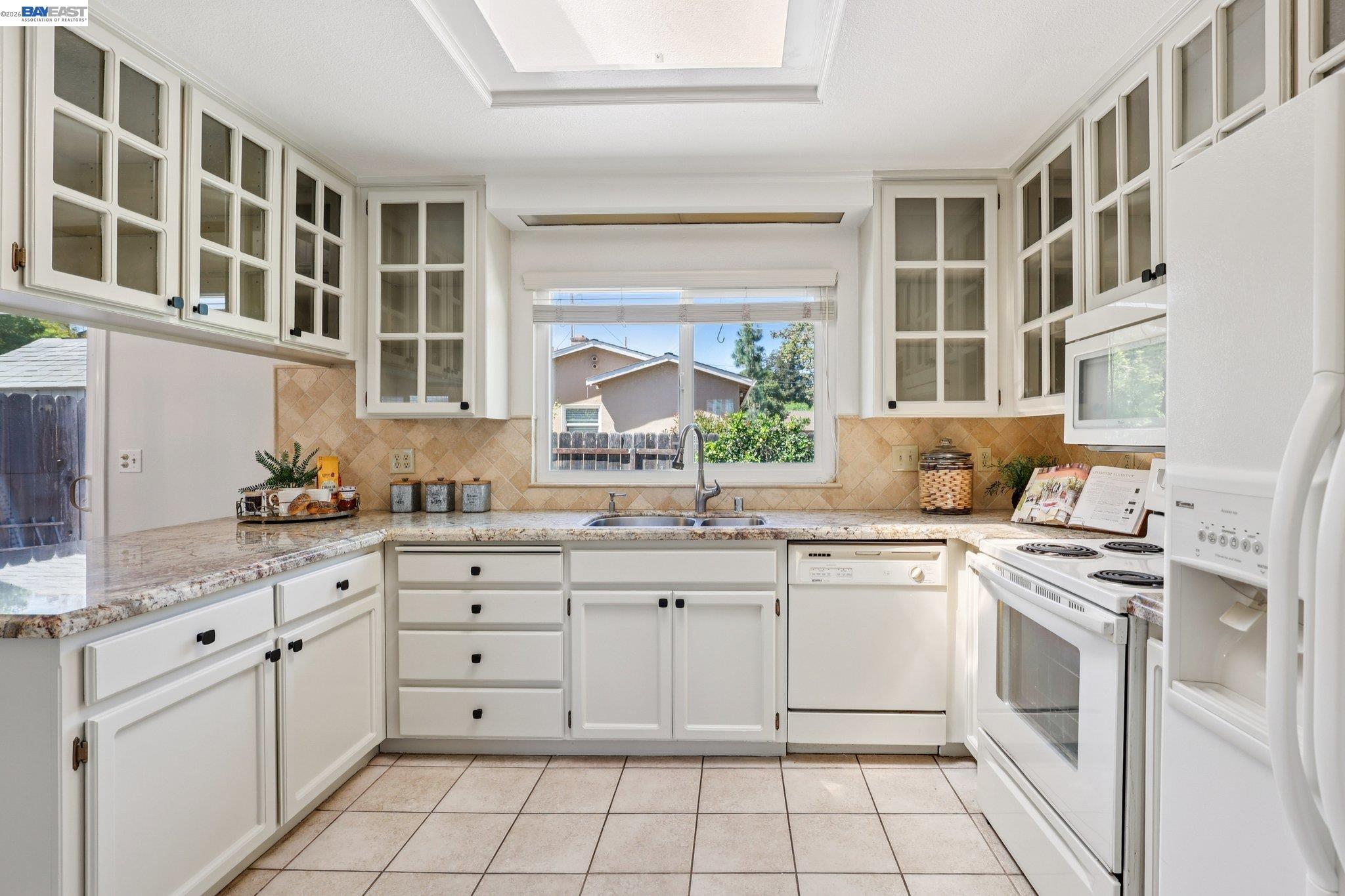 1113 Tokay Common Livermore, CA 94550 - Photo 13 of 30 a kitchen with cabinets appliances and a sink