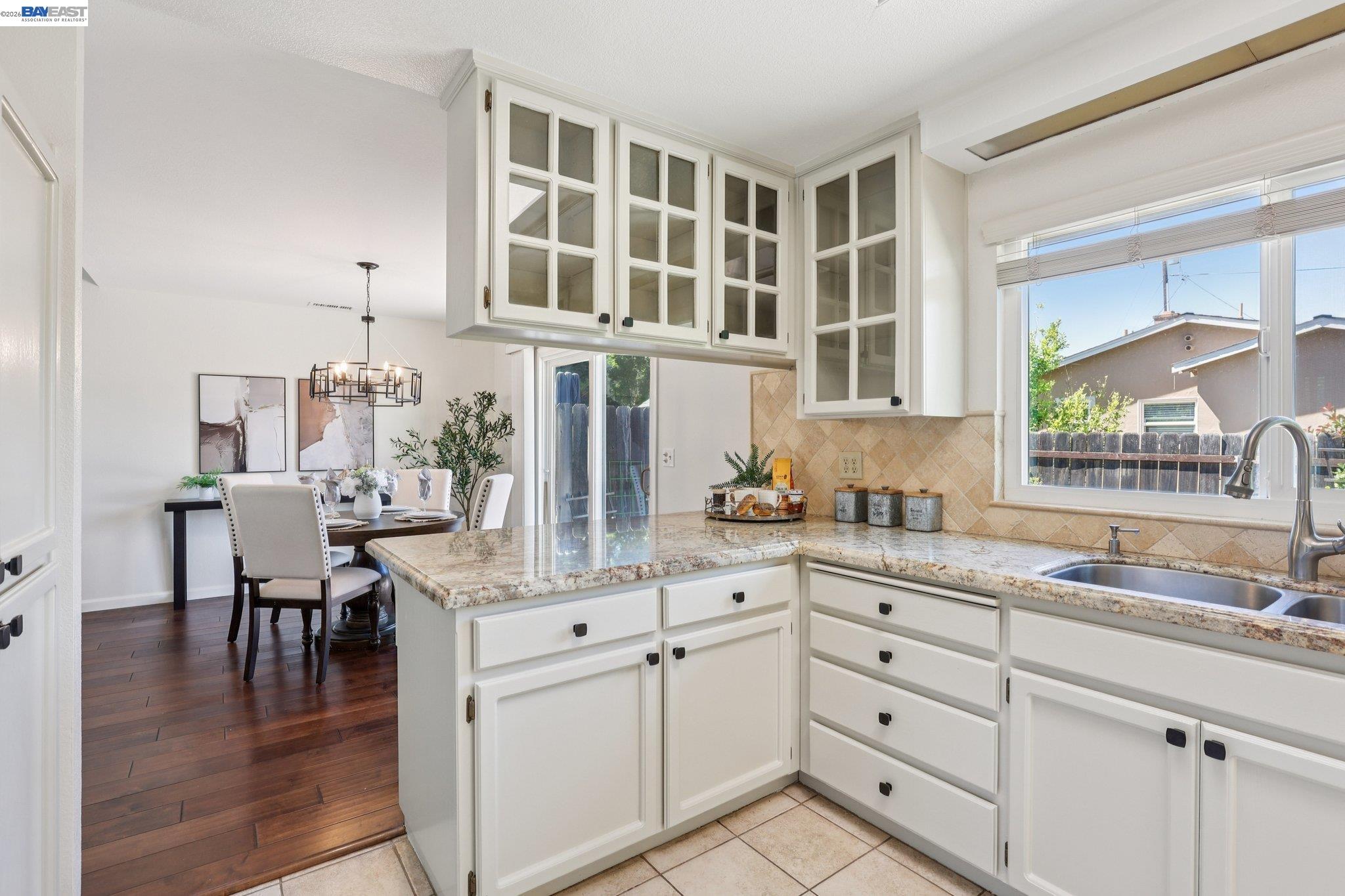 1113 Tokay Common Livermore, CA 94550 - Photo 14 of 30 a kitchen with cabinets appliances and a wooden floor