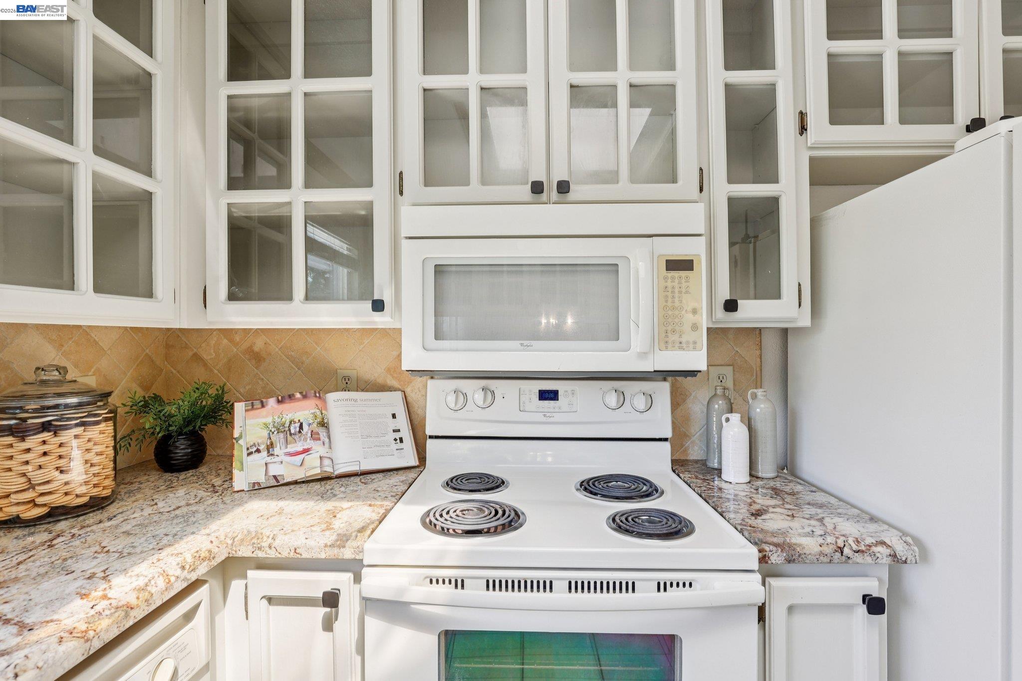 1113 Tokay Common Livermore, CA 94550 - Photo 16 of 30 a kitchen with a stove and a white cabinets
