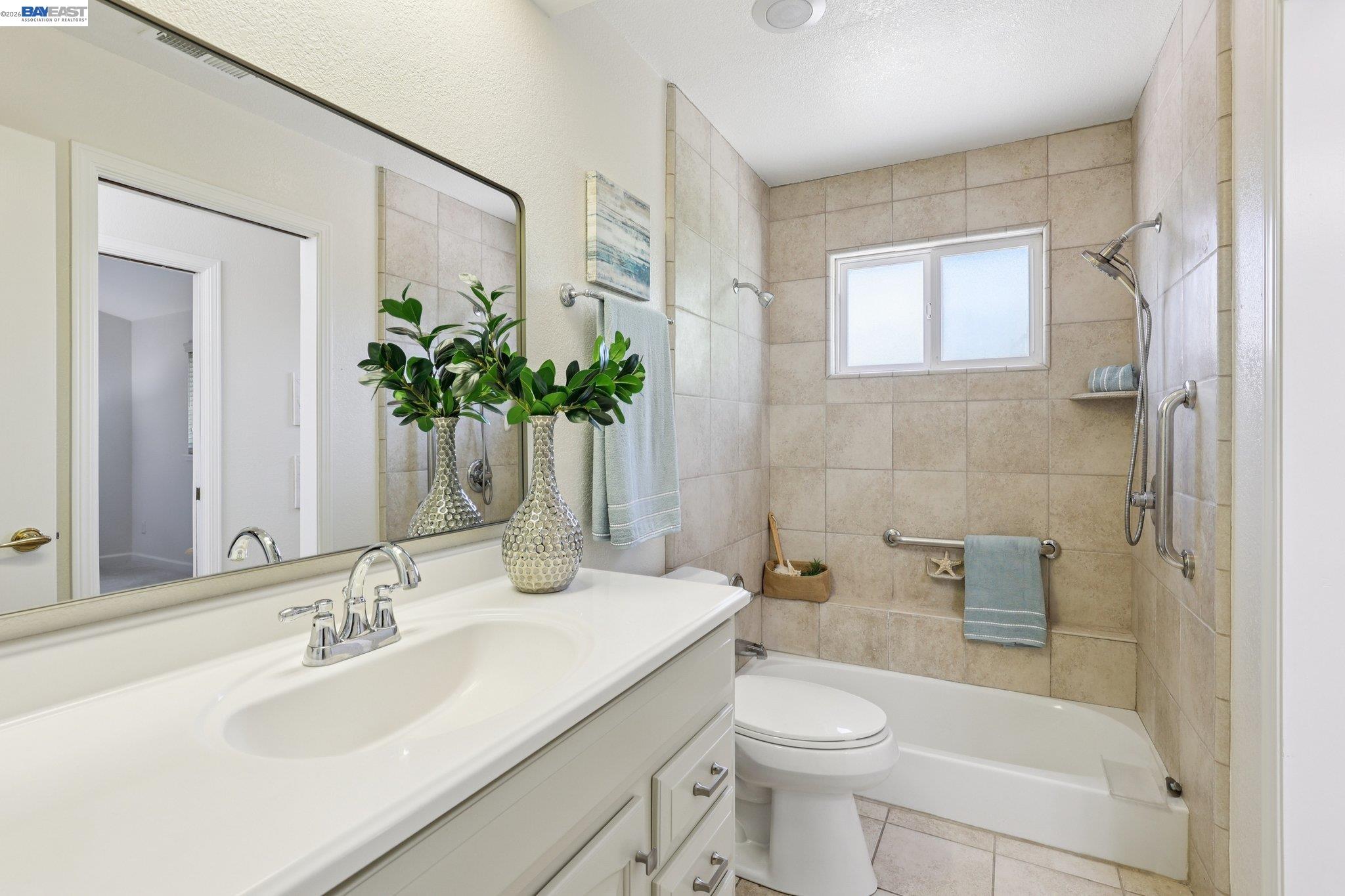 1113 Tokay Common Livermore, CA 94550 - Photo 19 of 30 a bathroom with a sink a toilet and shower