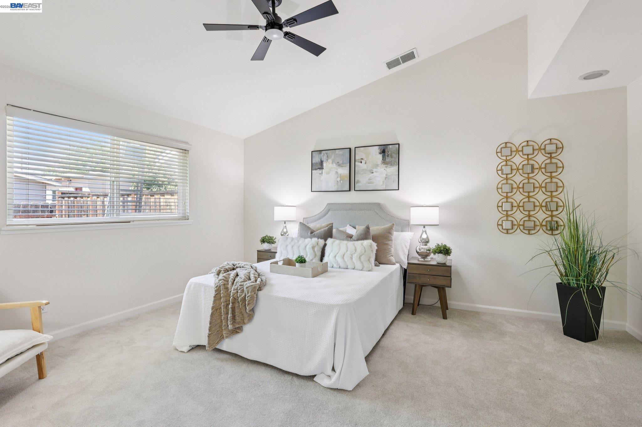 1113 Tokay Common Livermore, CA 94550 - Photo 20 of 30 a bedroom with a bed and a chandelier