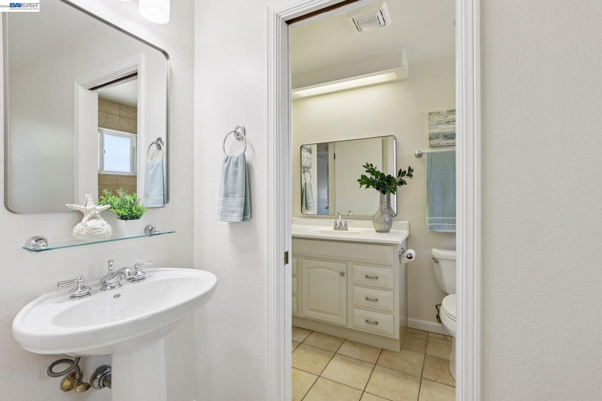 1113 Tokay Common Livermore, CA 94550 - Photo 25 of 30 a bathroom with a double vanity sink and a mirror