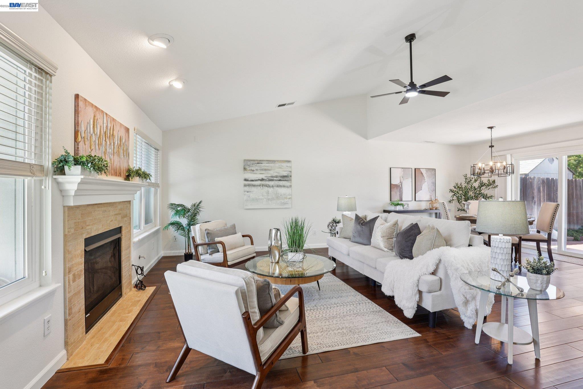 1113 Tokay Common Livermore, CA 94550 - Photo 7 of 30 a living room with furniture a fireplace and a flat screen tv