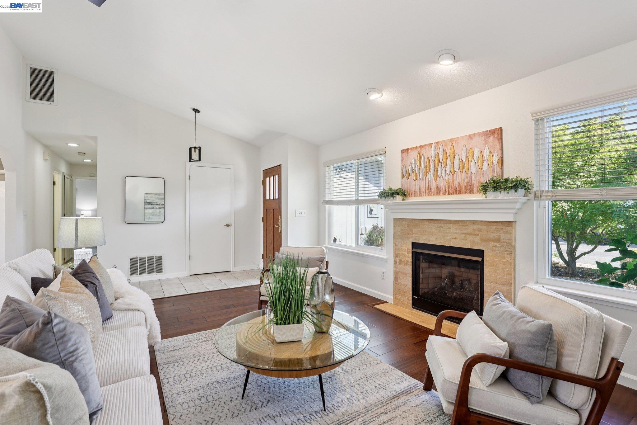 1113 Tokay Common Livermore, CA 94550 - Photo 8 of 30 a living room with furniture a fireplace and a large window