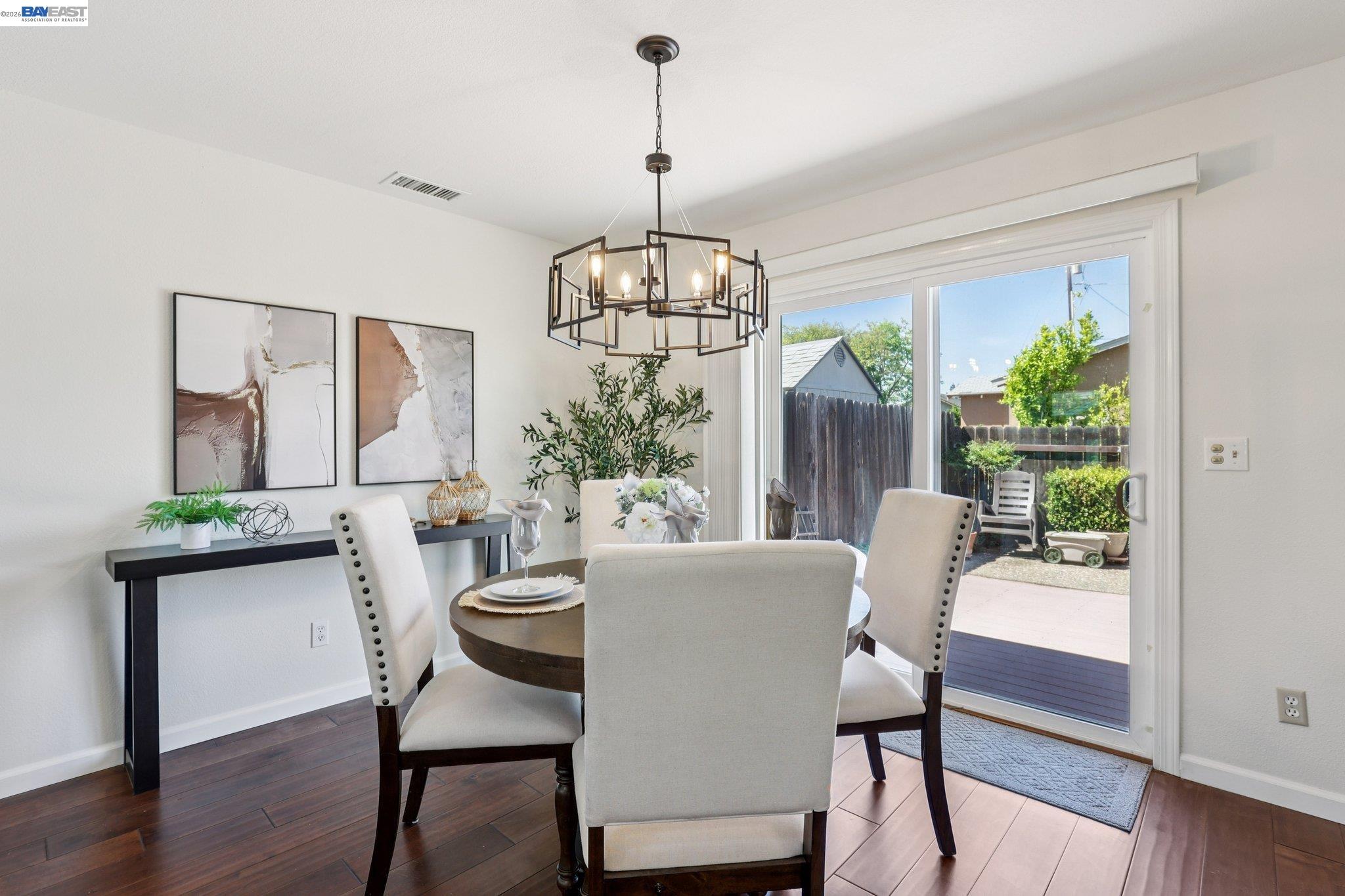 1113 Tokay Common Livermore, CA 94550 - Photo 9 of 30 a view of a dining room with furniture window and wooden floor
