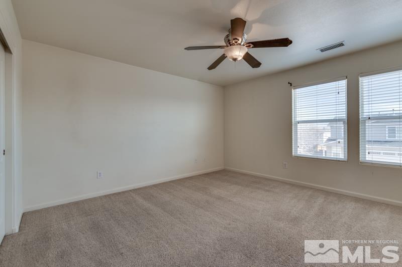 2924 Bryan Street Reno, NV 89503 - Photo 13 of 23 an empty room with windows and fan