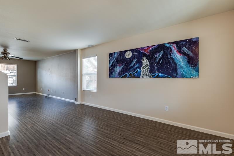 2924 Bryan Street Reno, NV 89503 - Photo 3 of 23 a view of a hallway with wooden floor and a workspace