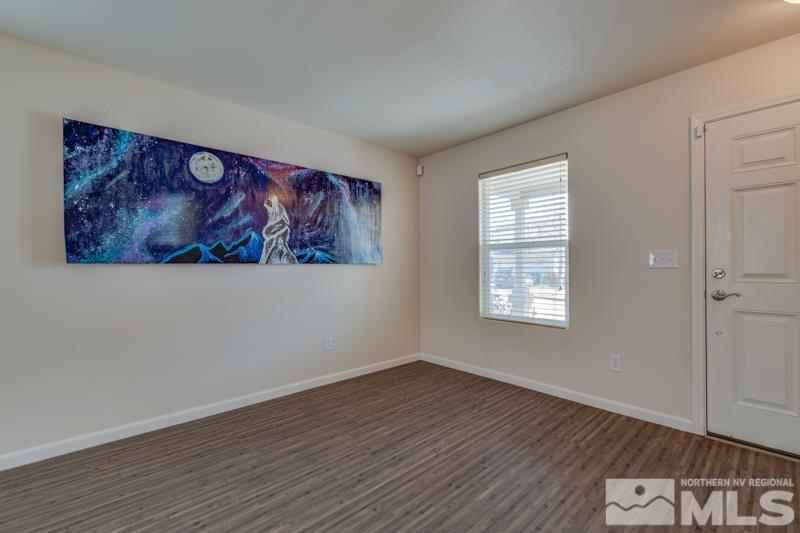 2924 Bryan Street Reno, NV 89503 - Photo 4 of 23 an empty room with wooden floor and window