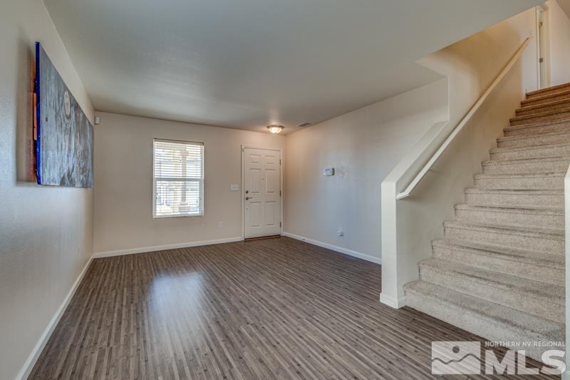 2924 Bryan Street Reno, NV 89503 - Photo 5 of 23 a view of an empty room with wooden floor and a window
