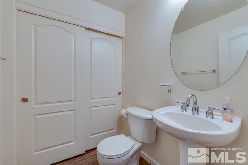 2924 Bryan Street Reno, NV 89503 - Photo 10 of 23 a bathroom with a sink a toilet and a mirror